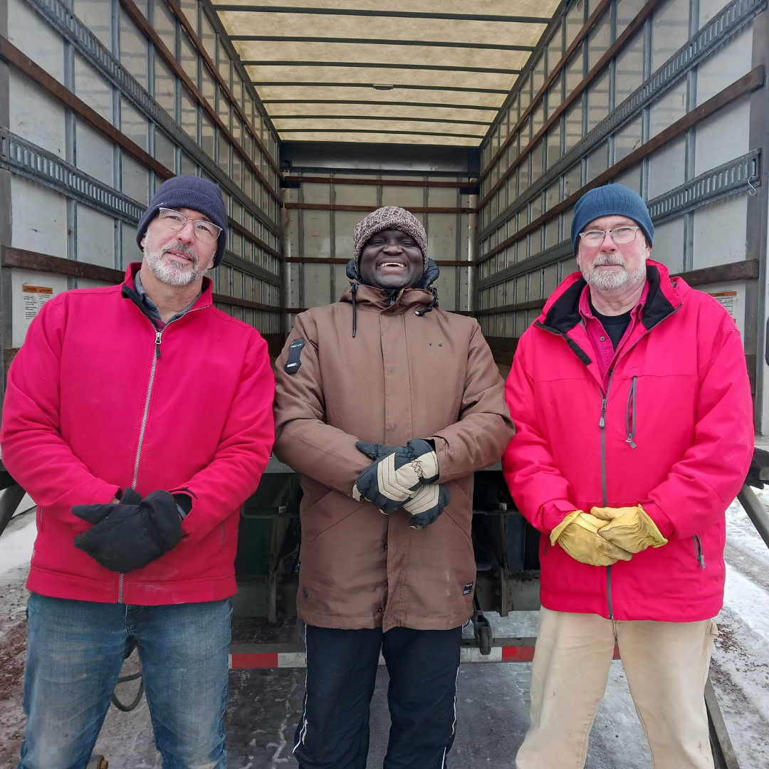 Volunteers in front of truck